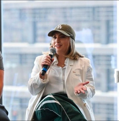 Diana speaking with a microphone